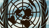 Photo: UN-Logo through a Window, Special "Reform of the UN Development System: Analysis and Comments"